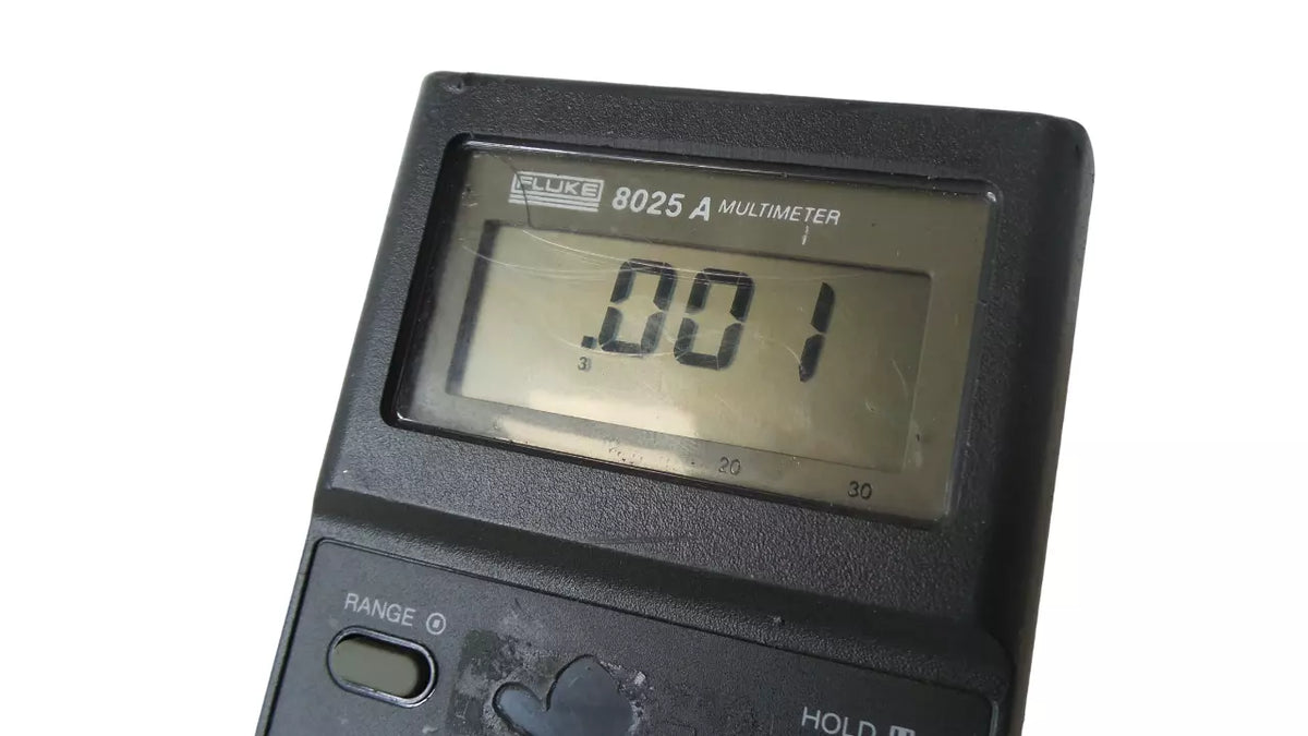 Fluke 8025A Multimeter with LCD Display and Voltage Measurement