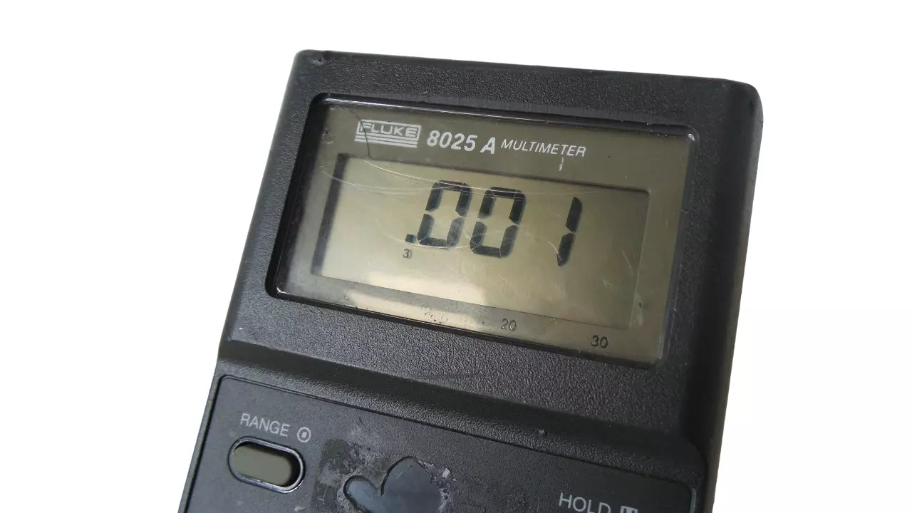 Fluke 8025A Multimeter with LCD Display and Voltage Measurement